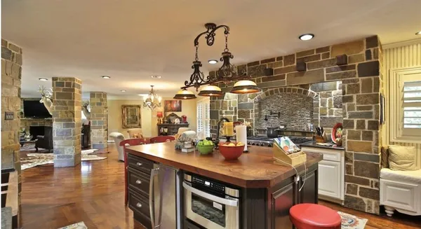 a bedroom with bed and wooden floor