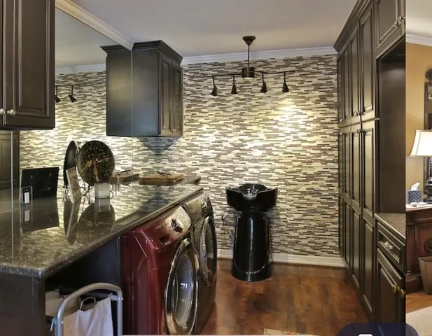 a bathroom with a double vanity sink mirror and shower
