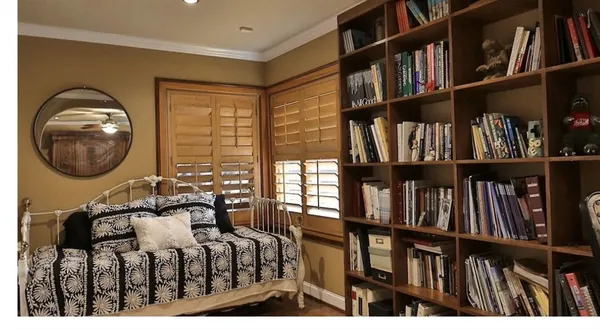 a bathroom with bathtub and window