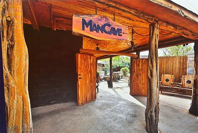 a bedroom with a bed and glass door