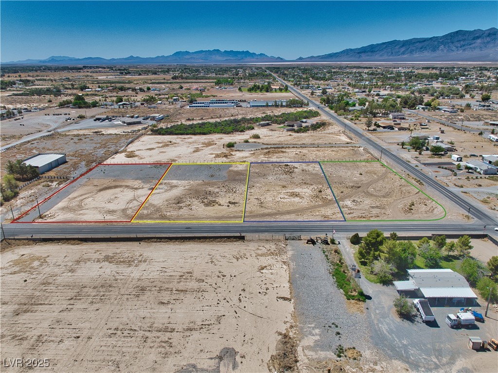 2121 East Manse Road Pahrump, NV 89048 - Photo 1 of 18 View of rural area with a mountain backdrop and property boundaries highlighted