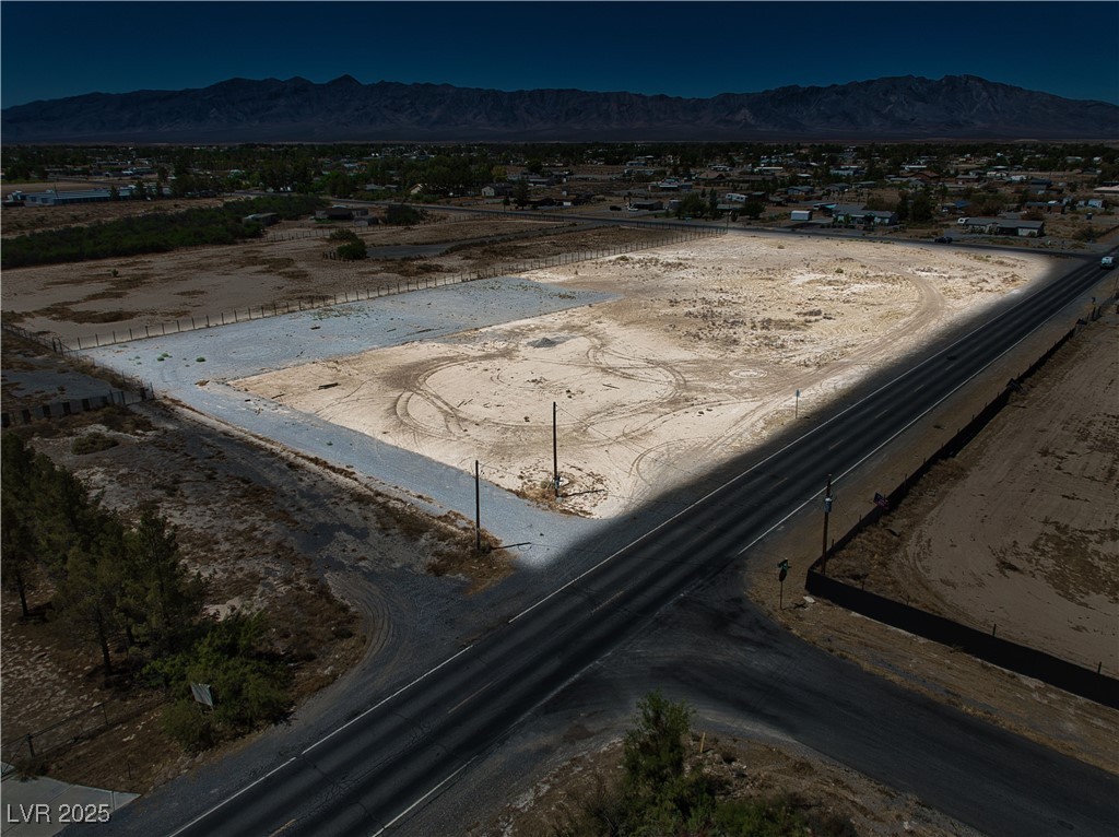 2121 East Manse Road Pahrump, NV 89048 - Photo 2 of 18 Overview of rural landscape with a mountain backdrop and a desert landscape