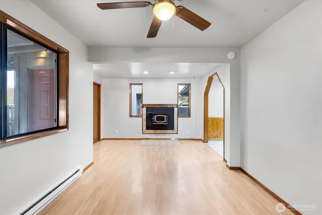 wooden floor in an empty room with a window