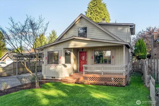 a front view of a house with a yard and porch