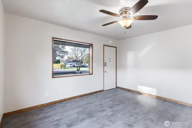 a view of an empty room with a window