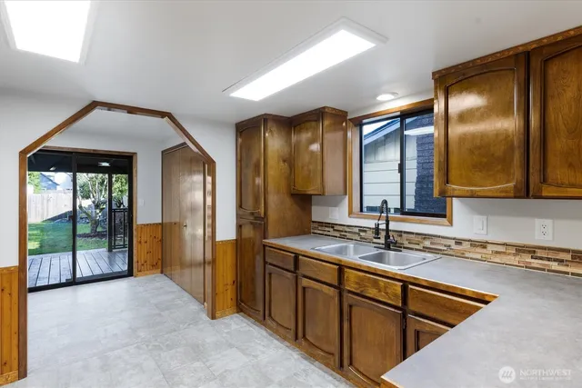 a bathroom with a sink and a mirror