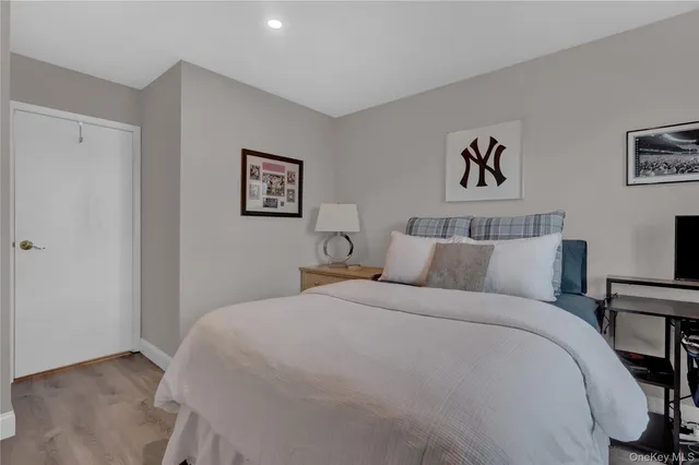 a bedroom with a bed and a table