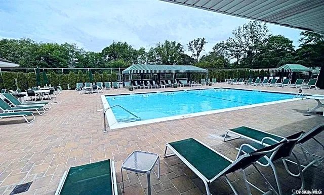 a view of a swimming pool with a patio