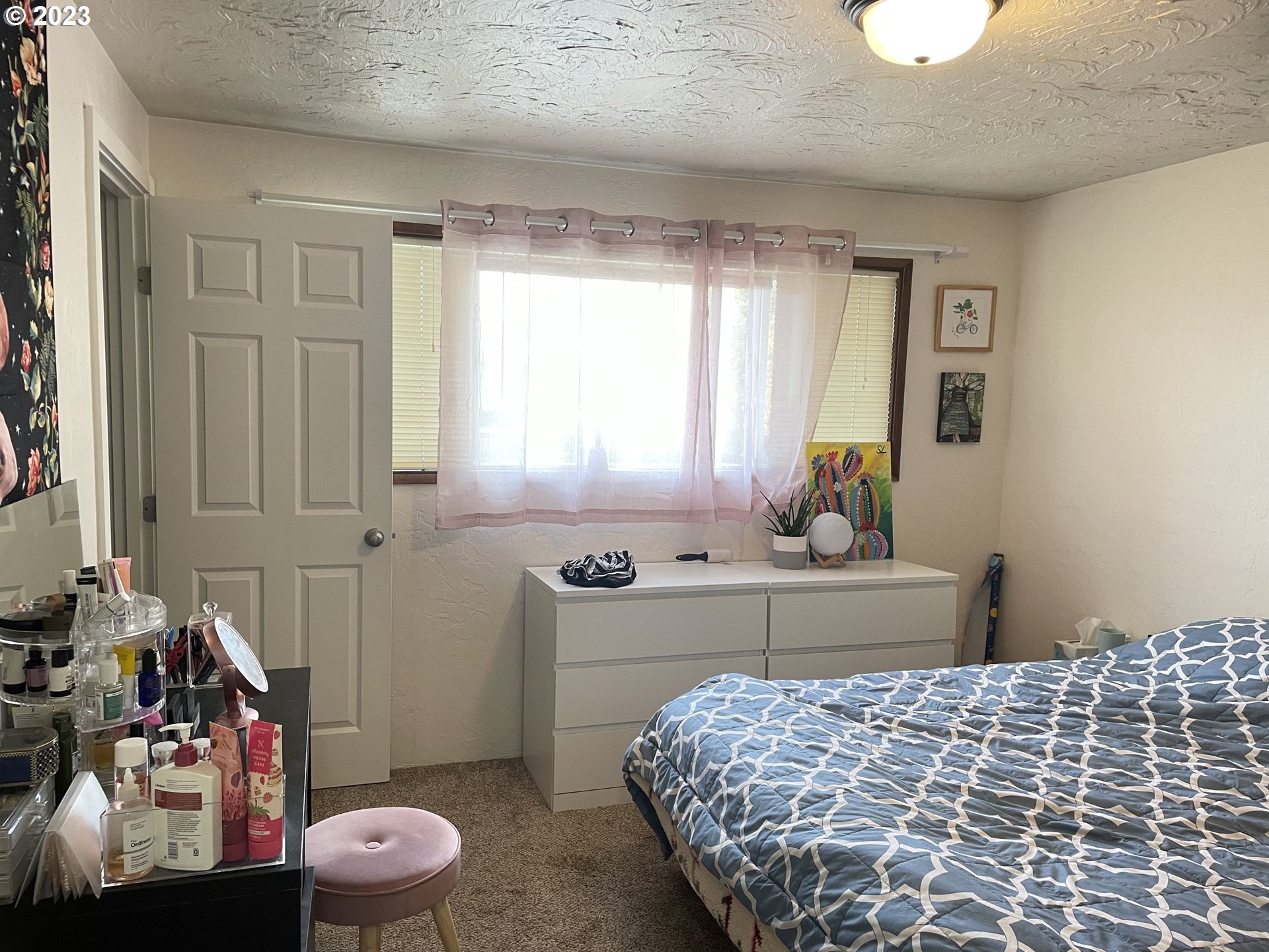 496 S Street Springfield, OR 97477 - Photo 6 of 11 a bedroom with a bed and a window