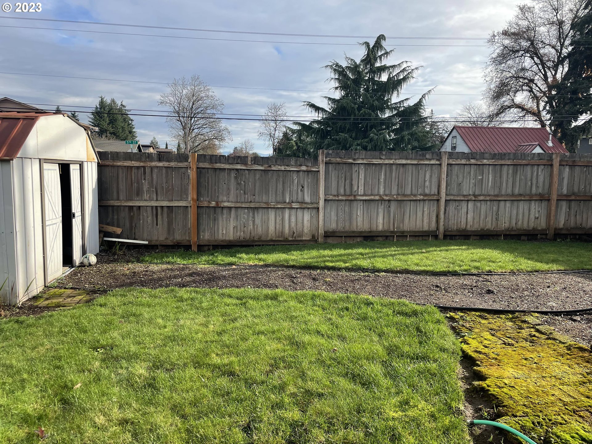 496 S Street Springfield, OR 97477 - Photo 9 of 11 a view of a backyard with wooden fence
