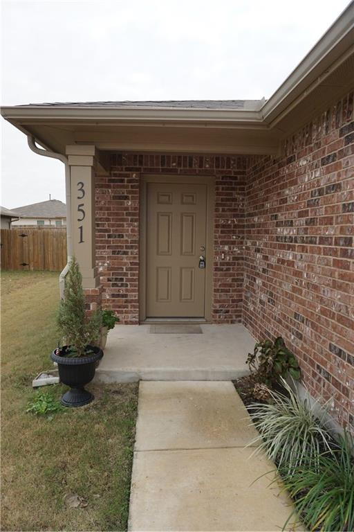 351 Musgrav Kyle, TX 78640 - Photo 2 of 21 a front view of a house with a garden