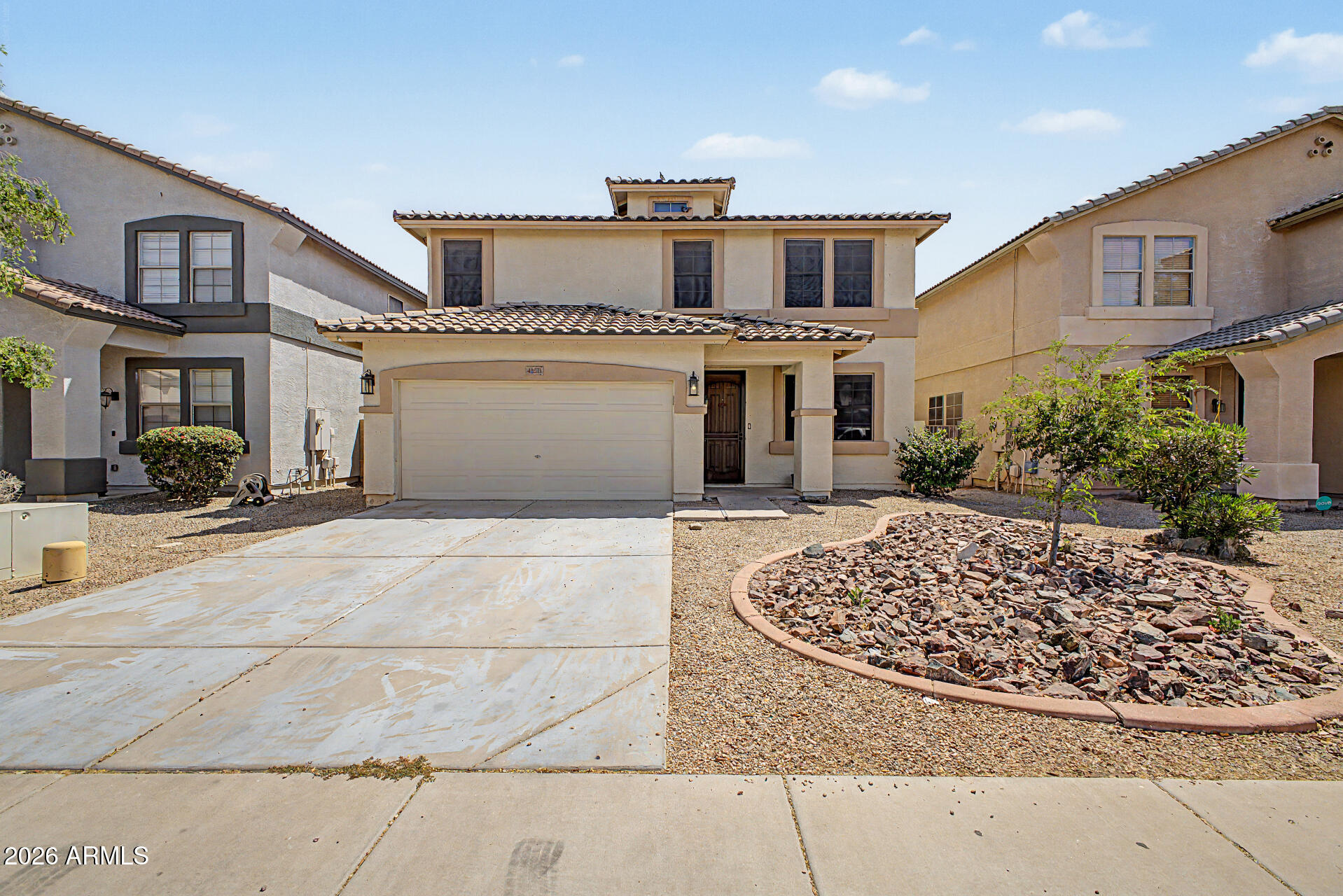 45571 West Tucker Road Maricopa, AZ 85139 - Photo 1 of 61 a front view of a house with garden