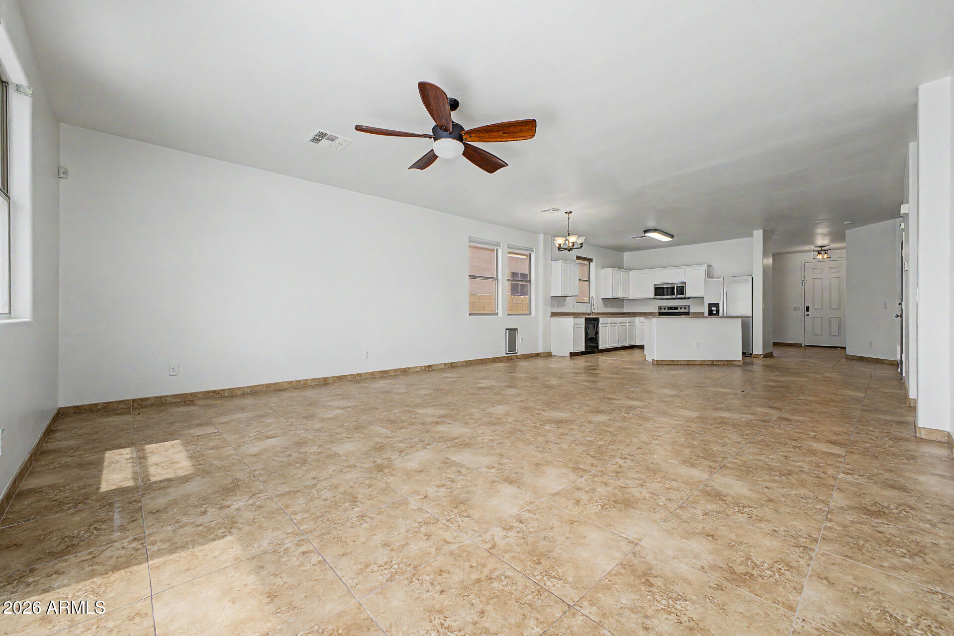 45571 West Tucker Road Maricopa, AZ 85139 - Photo 11 of 61 a view of a livingroom with furniture and a ceiling fan