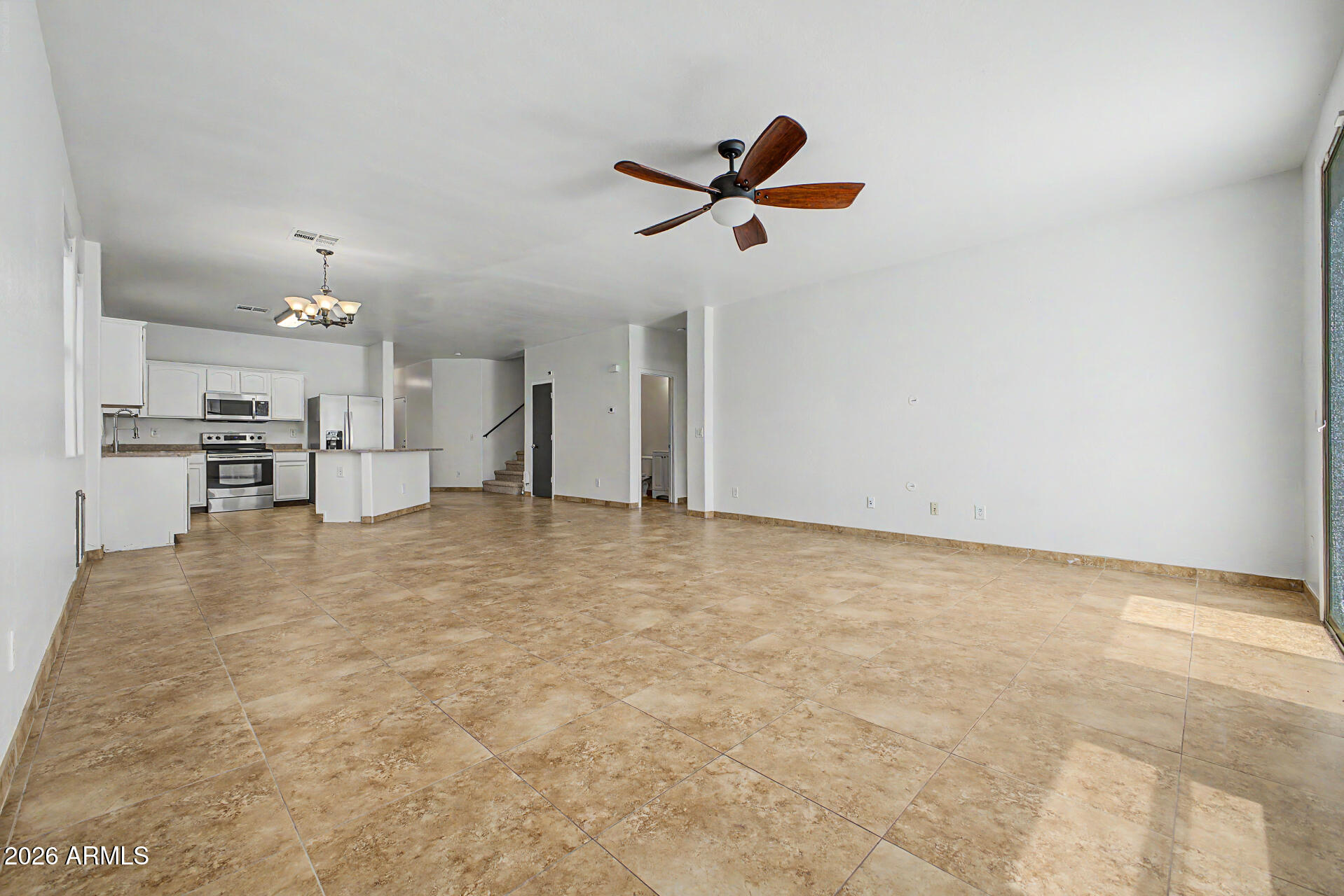 45571 West Tucker Road Maricopa, AZ 85139 - Photo 12 of 61 a view of a livingroom with a kitchen