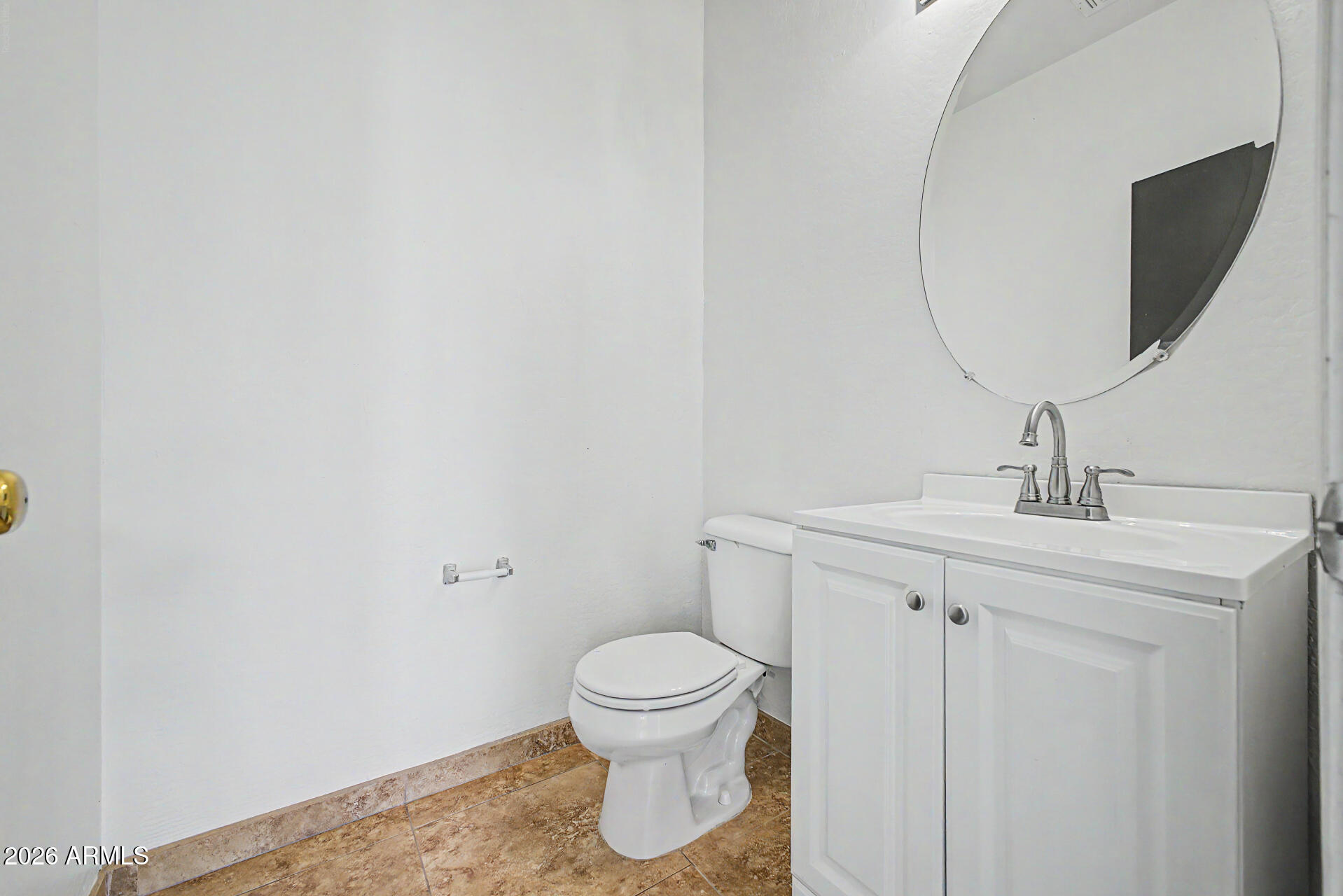 45571 West Tucker Road Maricopa, AZ 85139 - Photo 21 of 61 a bathroom with a toilet a sink and mirror