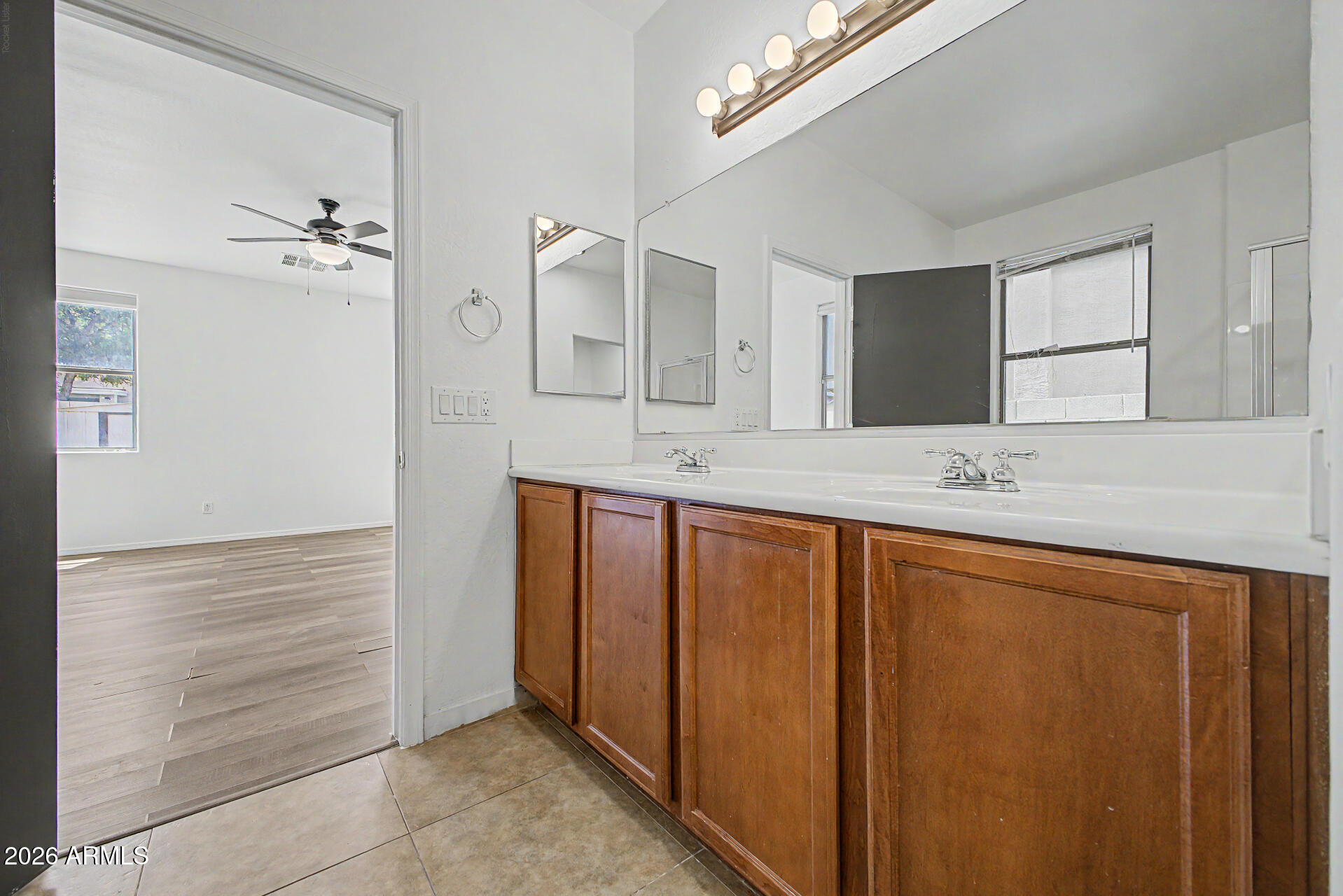 45571 West Tucker Road Maricopa, AZ 85139 - Photo 28 of 61 a bathroom with a granite countertop sink and a mirror