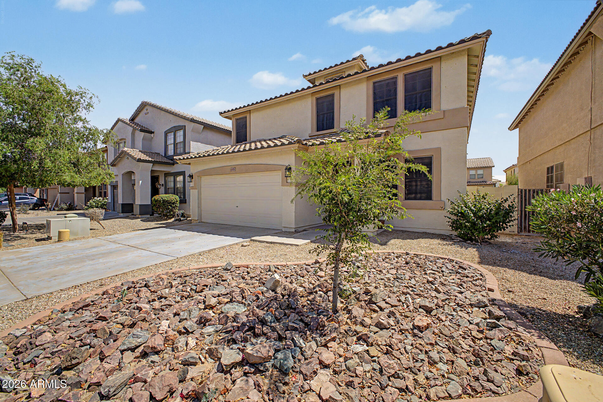 45571 West Tucker Road Maricopa, AZ 85139 - Photo 3 of 61 a front view of a house with a yard