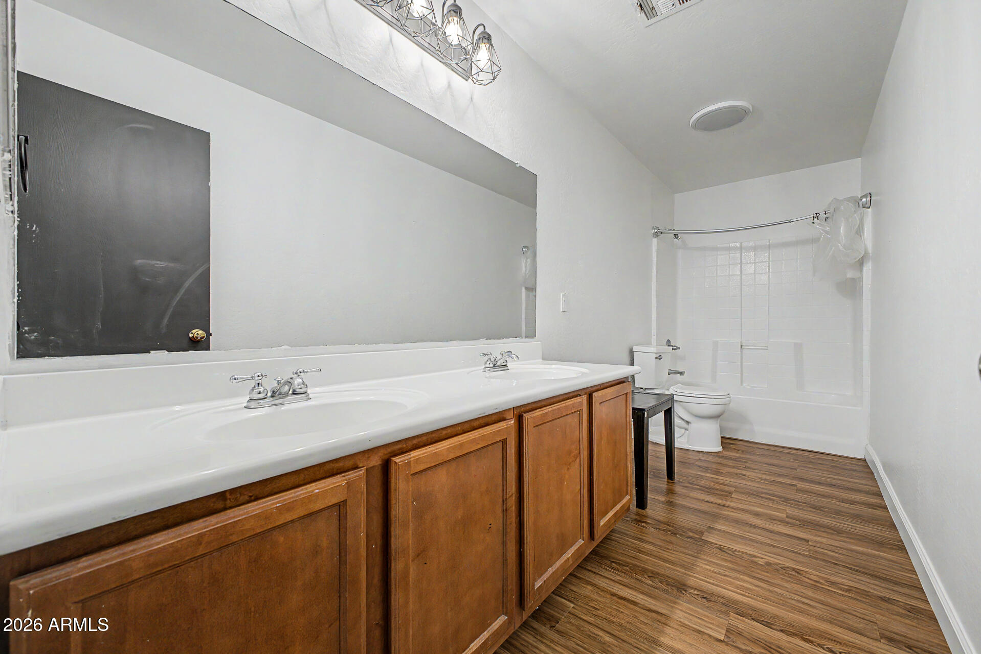 45571 West Tucker Road Maricopa, AZ 85139 - Photo 34 of 61 a bathroom with a double vanity sink and a mirror
