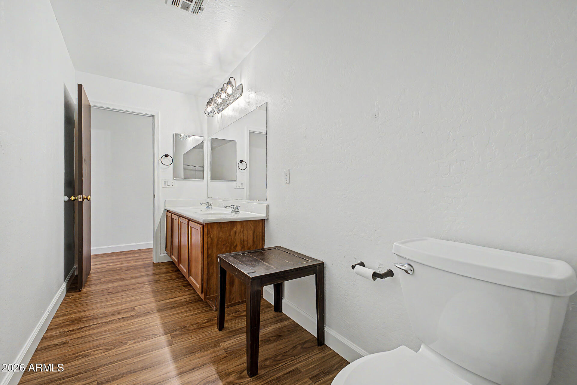45571 West Tucker Road Maricopa, AZ 85139 - Photo 35 of 61 a bathroom with a toilet a sink and mirror