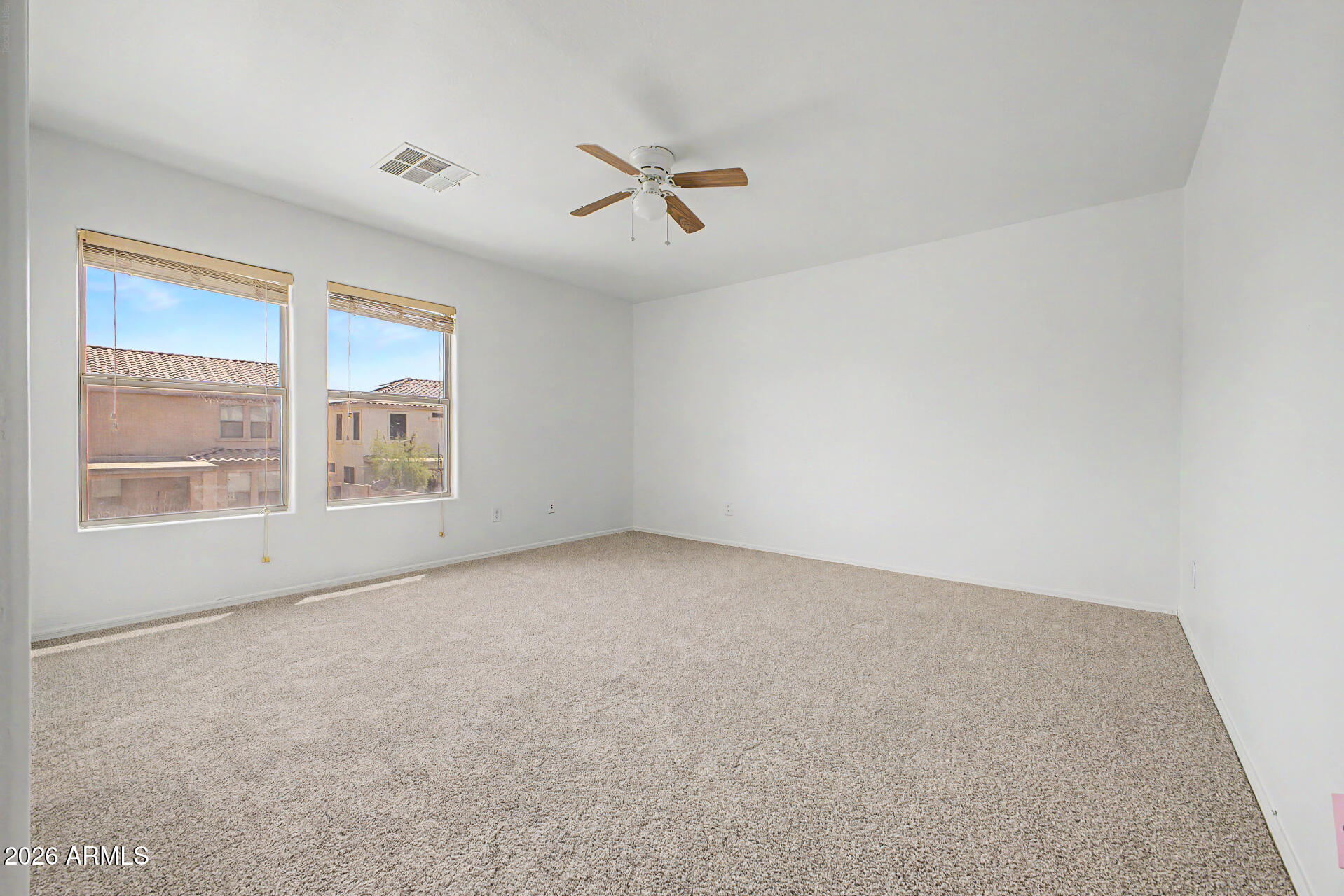 45571 West Tucker Road Maricopa, AZ 85139 - Photo 40 of 61 an empty room with windows