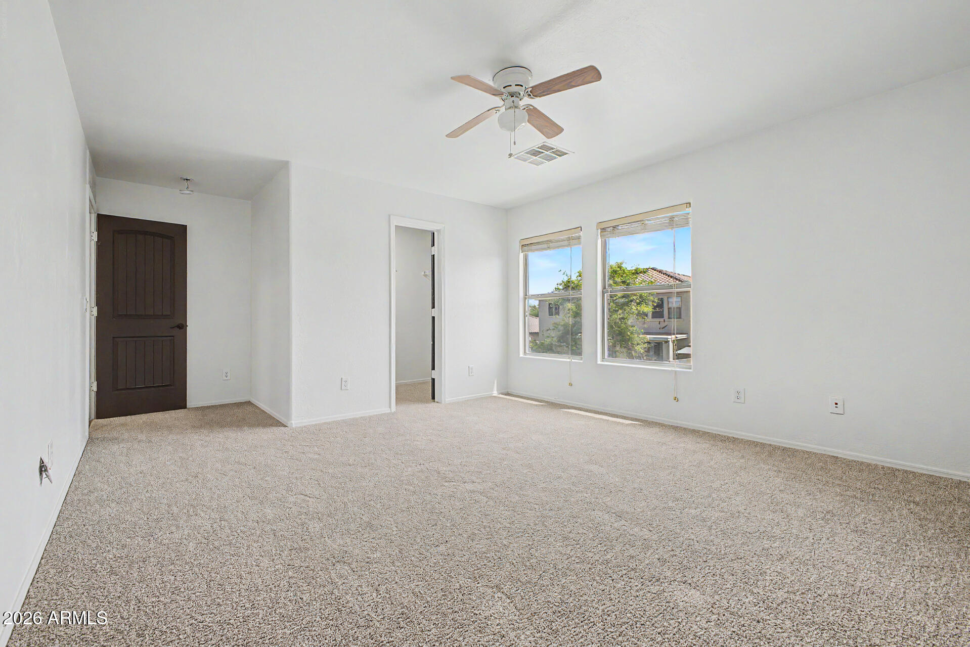45571 West Tucker Road Maricopa, AZ 85139 - Photo 41 of 61 an empty room with windows and fan