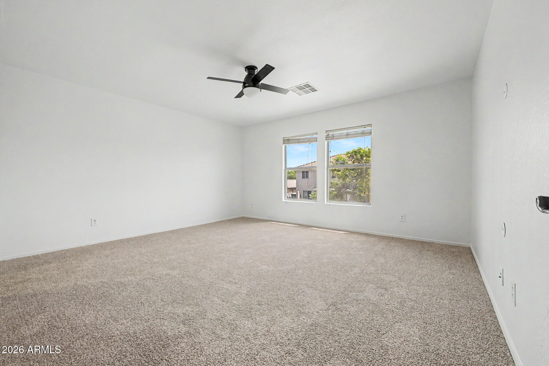 45571 West Tucker Road Maricopa, AZ 85139 - Photo 43 of 61 an empty room with windows