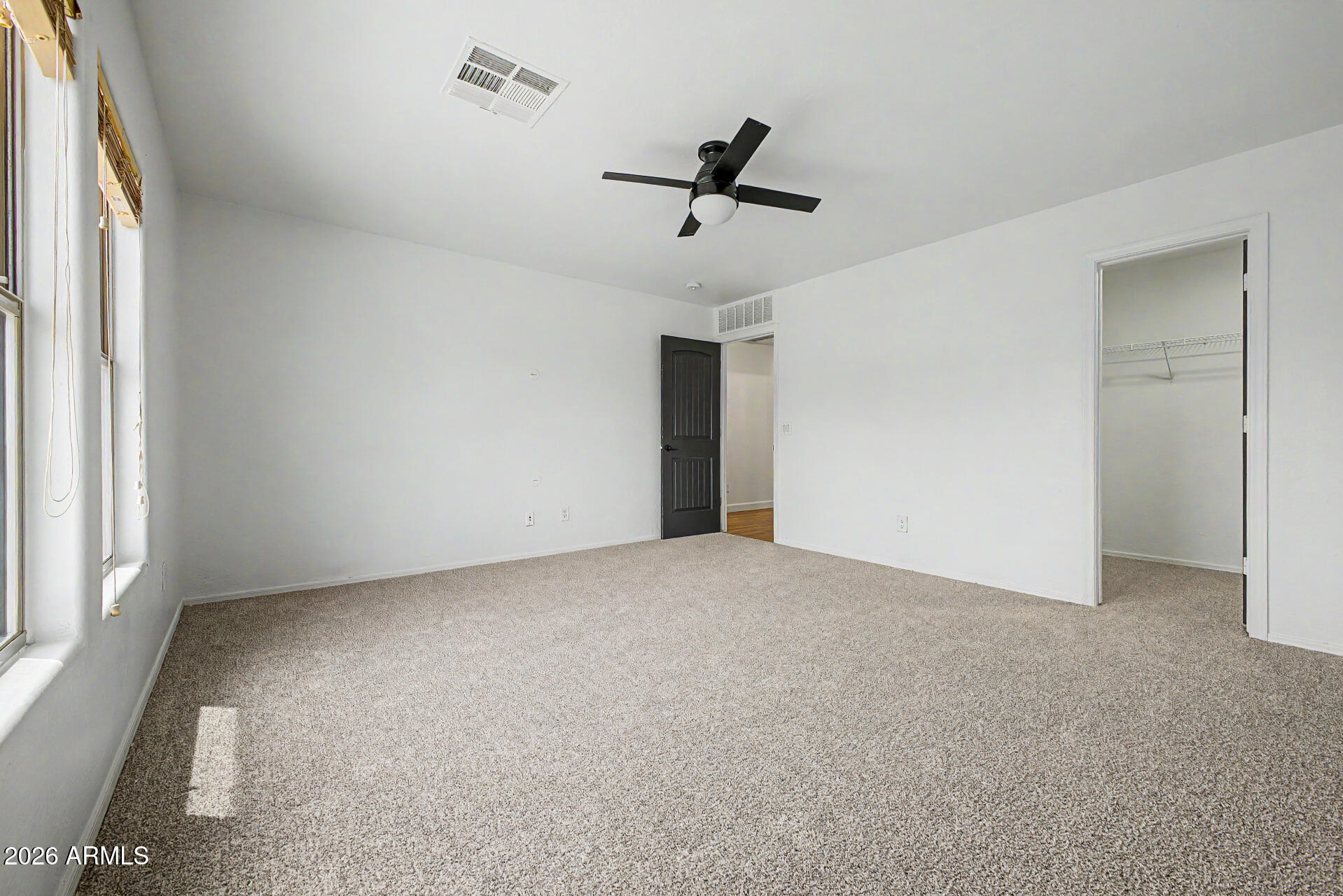 45571 West Tucker Road Maricopa, AZ 85139 - Photo 44 of 61 a view of a livingroom with a ceiling fan and window
