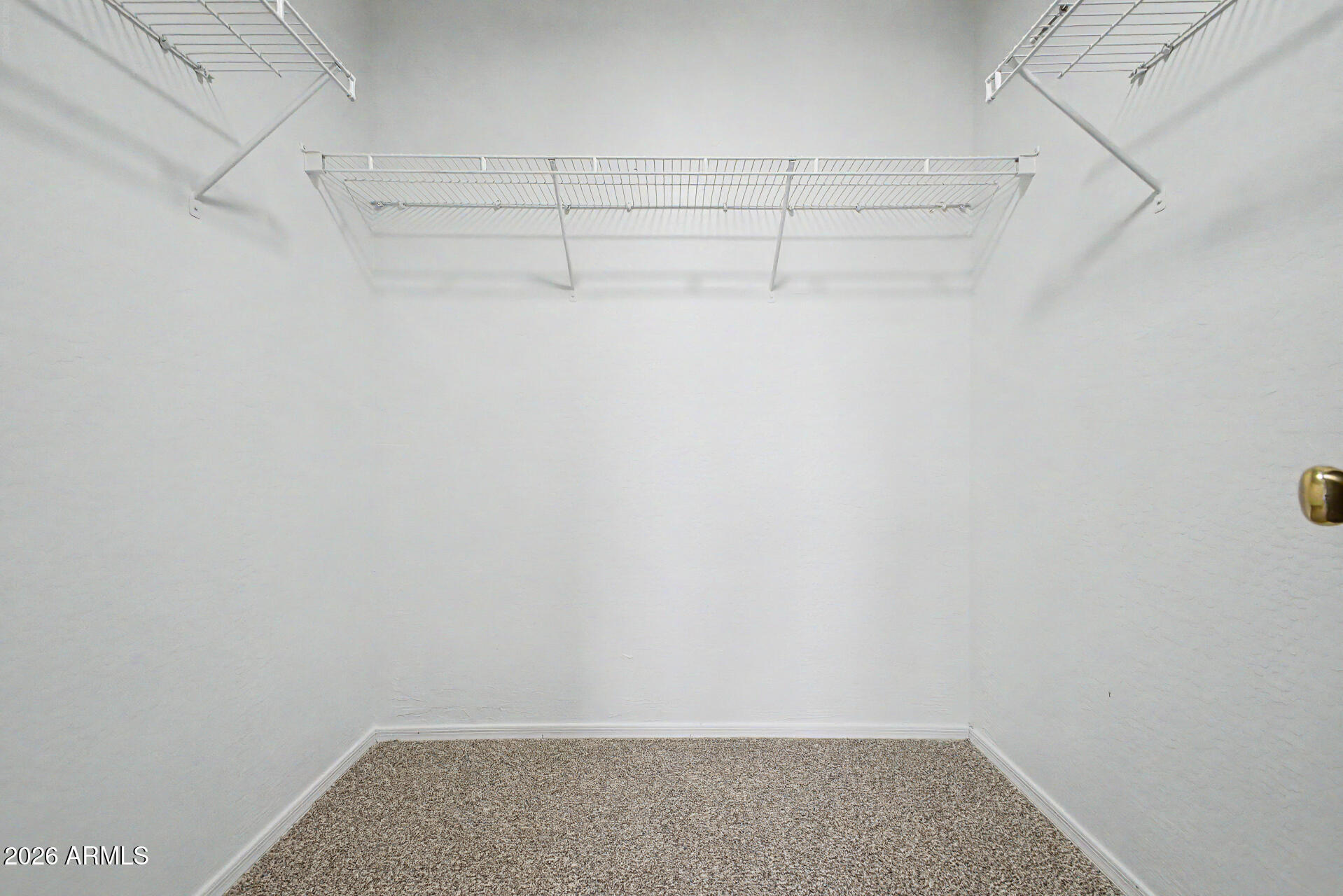 45571 West Tucker Road Maricopa, AZ 85139 - Photo 45 of 61 a view of a room with racks on the wall