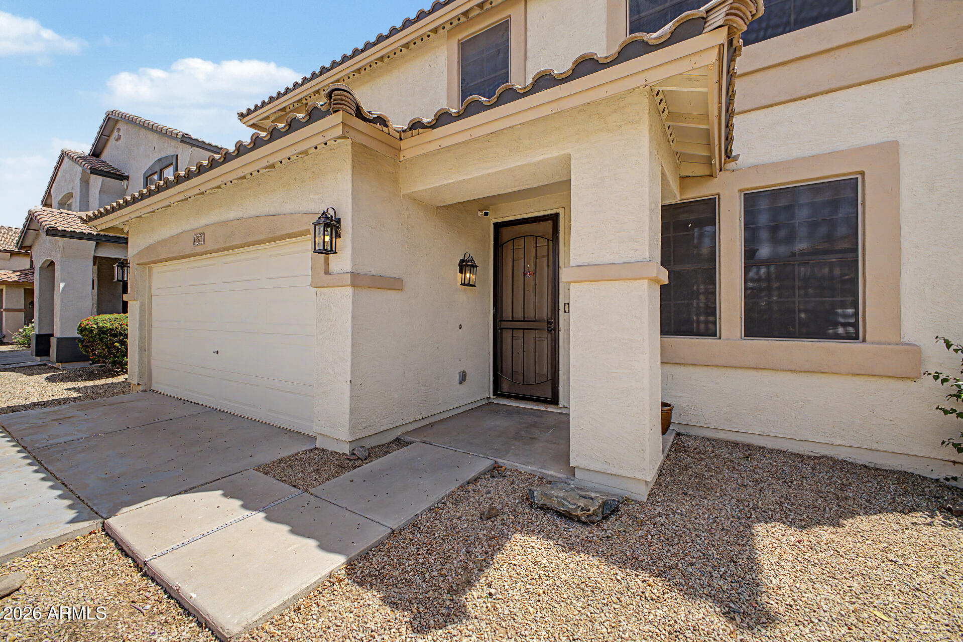 45571 West Tucker Road Maricopa, AZ 85139 - Photo 5 of 61 a view of a house with a white door