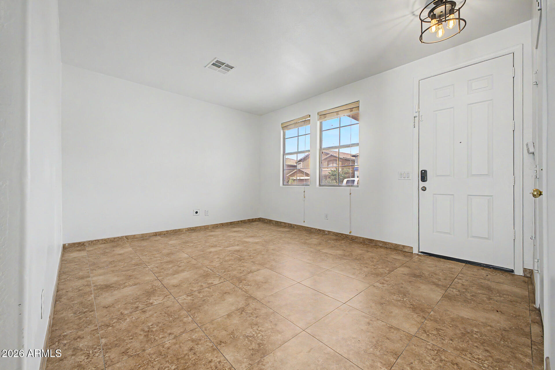45571 West Tucker Road Maricopa, AZ 85139 - Photo 8 of 61 an empty room with windows