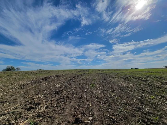 a view of a field with an outdoor space