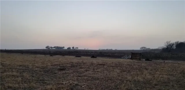 a view of a lake view with houses in the back