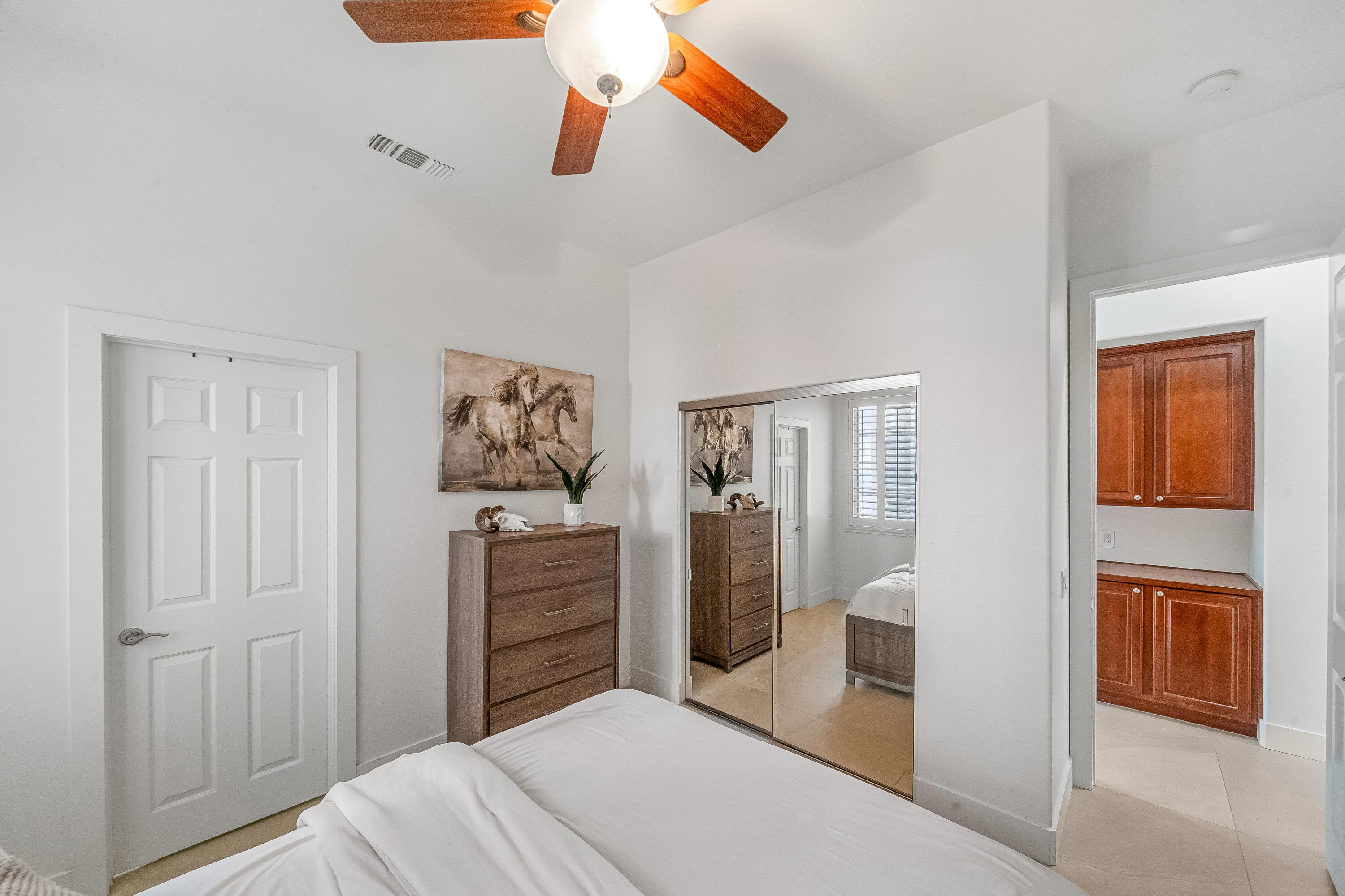 80262 Amazon Avenue Indio, CA 92201 - Photo 41 of 69 a bedroom with a bed and wooden floor