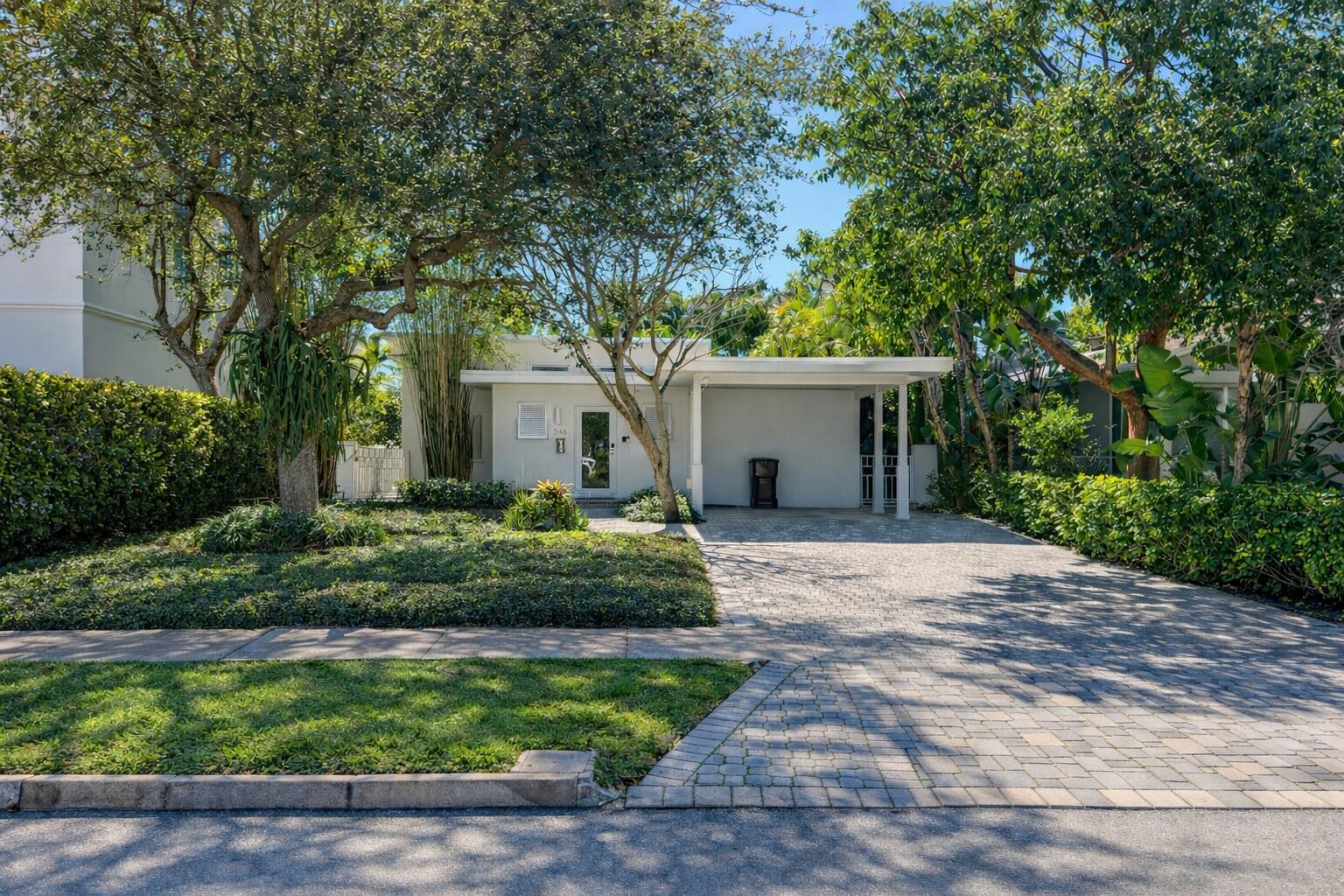248 Cortez Road West Palm Beach, FL 33405 - Photo 1 of 17 a front view of a house with a garden