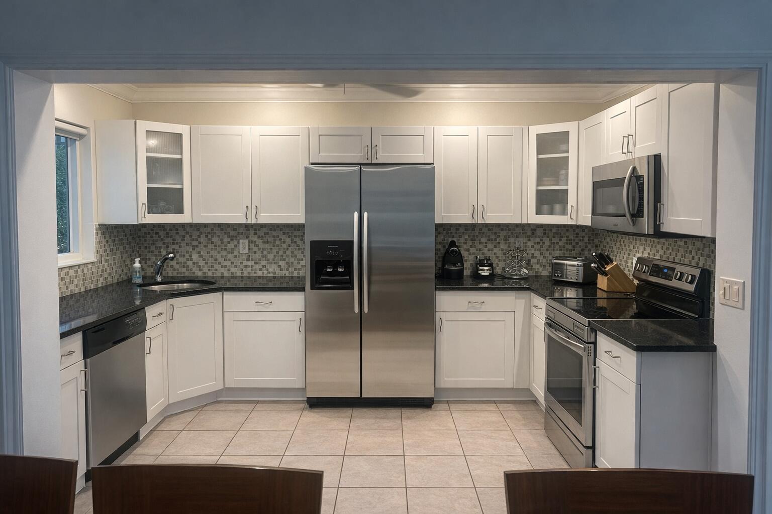 248 Cortez Road West Palm Beach, FL 33405 - Photo 11 of 17 a kitchen with a refrigerator sink and cabinets