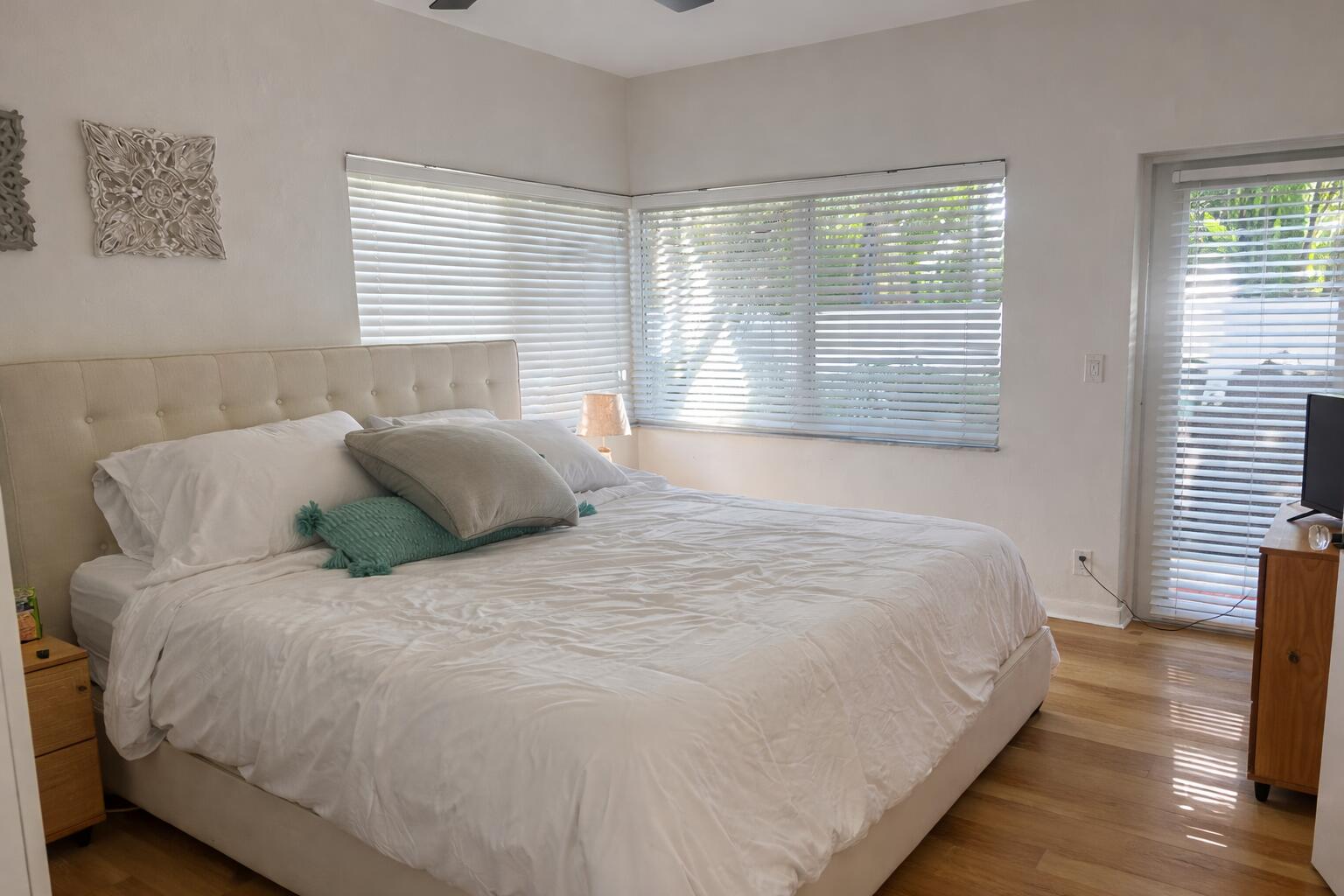 248 Cortez Road West Palm Beach, FL 33405 - Photo 13 of 17 a large bed sitting in a bedroom next to a window