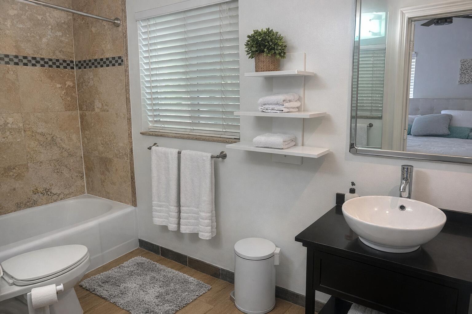 248 Cortez Road West Palm Beach, FL 33405 - Photo 14 of 17 a bathroom with a sink toilet a mirror and bathtub