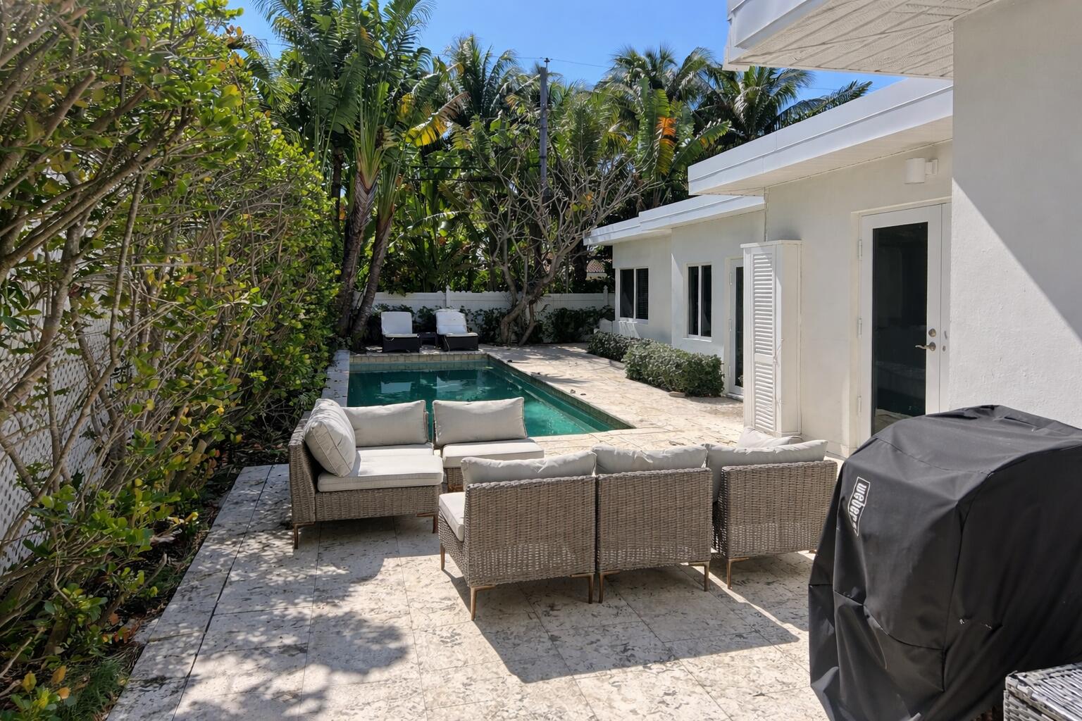 248 Cortez Road West Palm Beach, FL 33405 - Photo 2 of 17 a backyard of a house with seating space