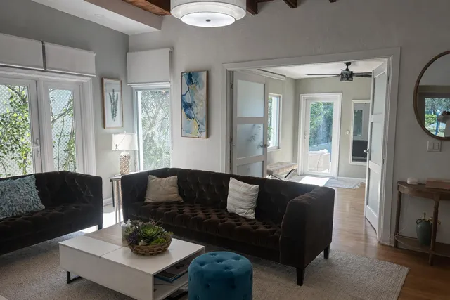 a living room with furniture and a large window