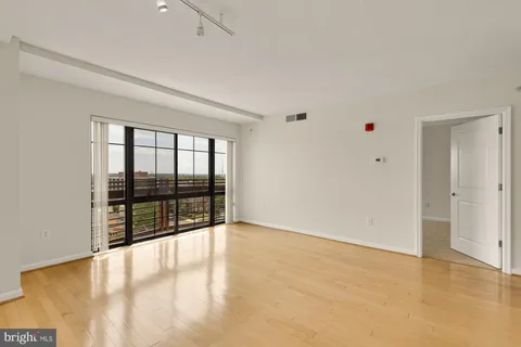a view of an empty room with a window