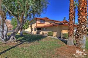 72664 Eagle Road, Unit 3 Palm Desert, CA 92260 - Photo 1 of 16 a view of a house with a yard