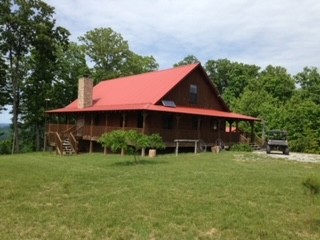 1229 Ayers Road Rock Island, TN 38581 - Photo 4 of 69 a front view of a house with garden
