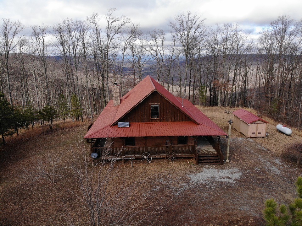 1229 Ayers Road Rock Island, TN 38581 - Photo 8 of 69 a house with trees in the background