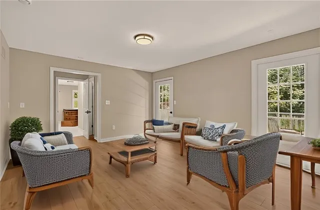 a living room with furniture and windows