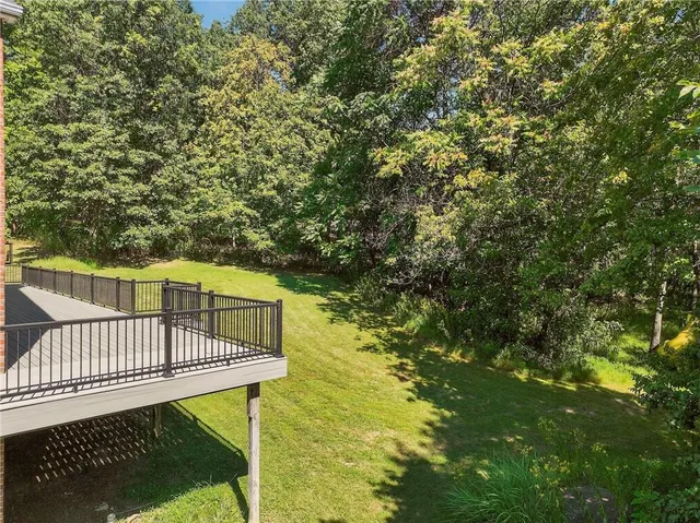a view of a balcony with wooden floor