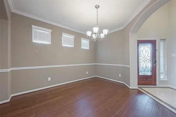 a view of staircase with white walls and a next to a window