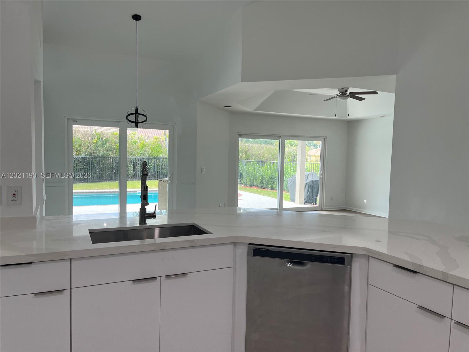 814 Heron Road Weston, FL 33326 - Photo 19 of 27 a kitchen with a sink and window