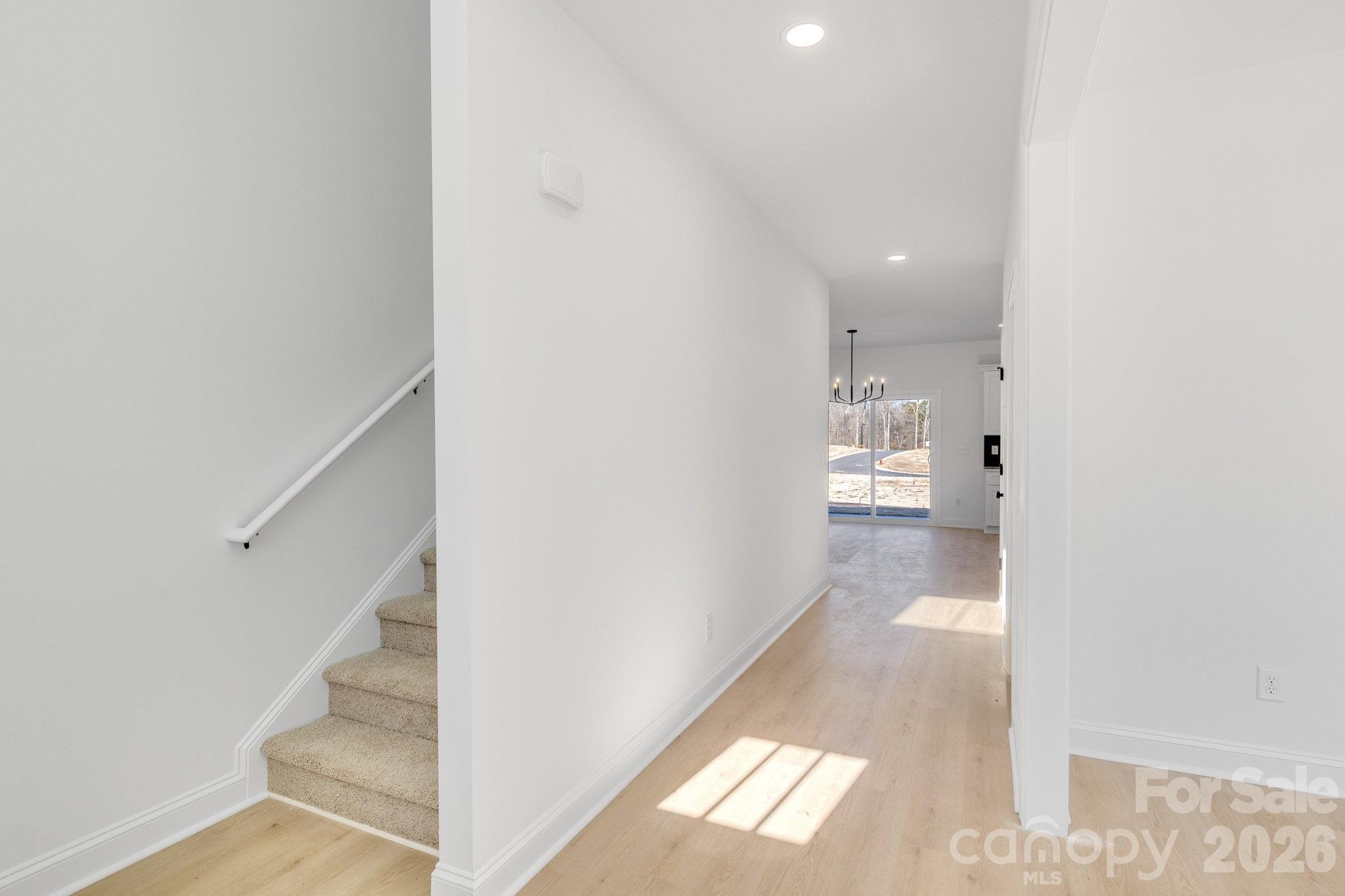 1335 Winged Way, Unit 4 Kannapolis, NC 28083 - Photo 11 of 29 a view of a hallway with wooden floor and staircase