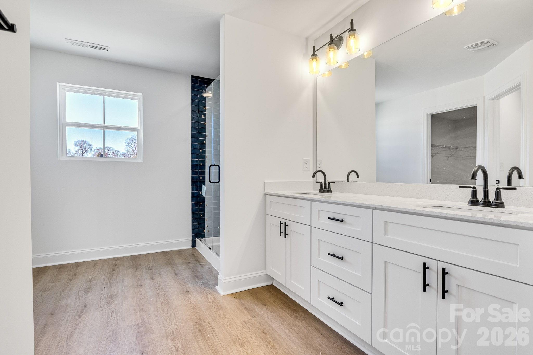 1335 Winged Way, Unit 4 Kannapolis, NC 28083 - Photo 14 of 29 a spacious bathroom with double sink and a mirror