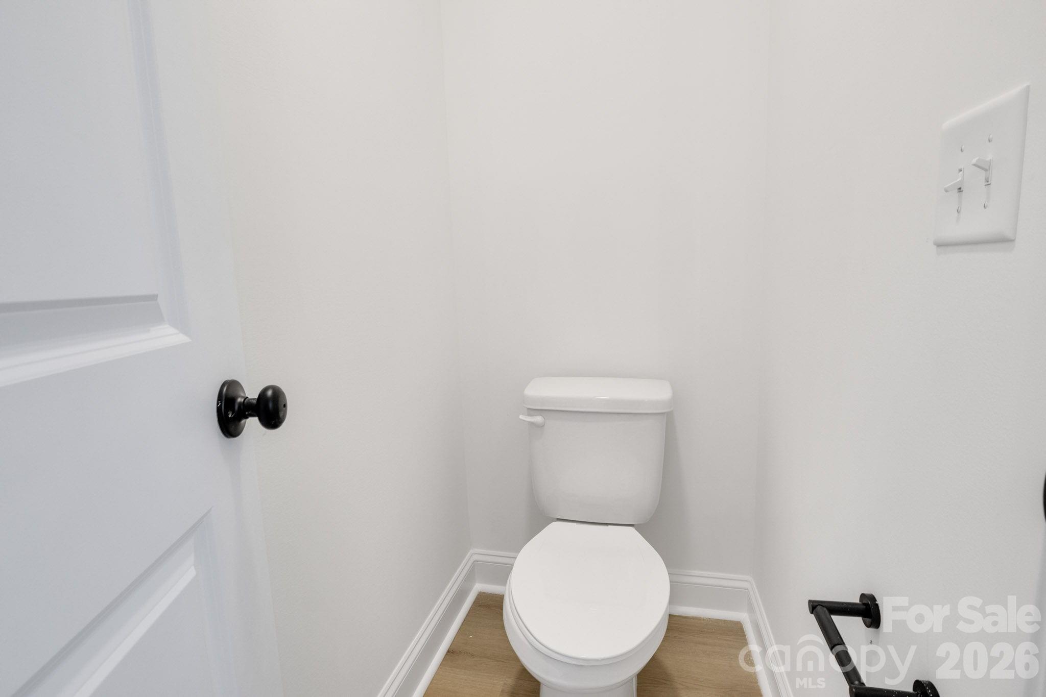 1335 Winged Way, Unit 4 Kannapolis, NC 28083 - Photo 18 of 29 a white toilet sitting next to a white wall